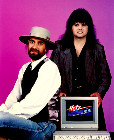 Mick Fleetwood and Jimmy Hotz with Atari Computer running the Hotz Translator Software